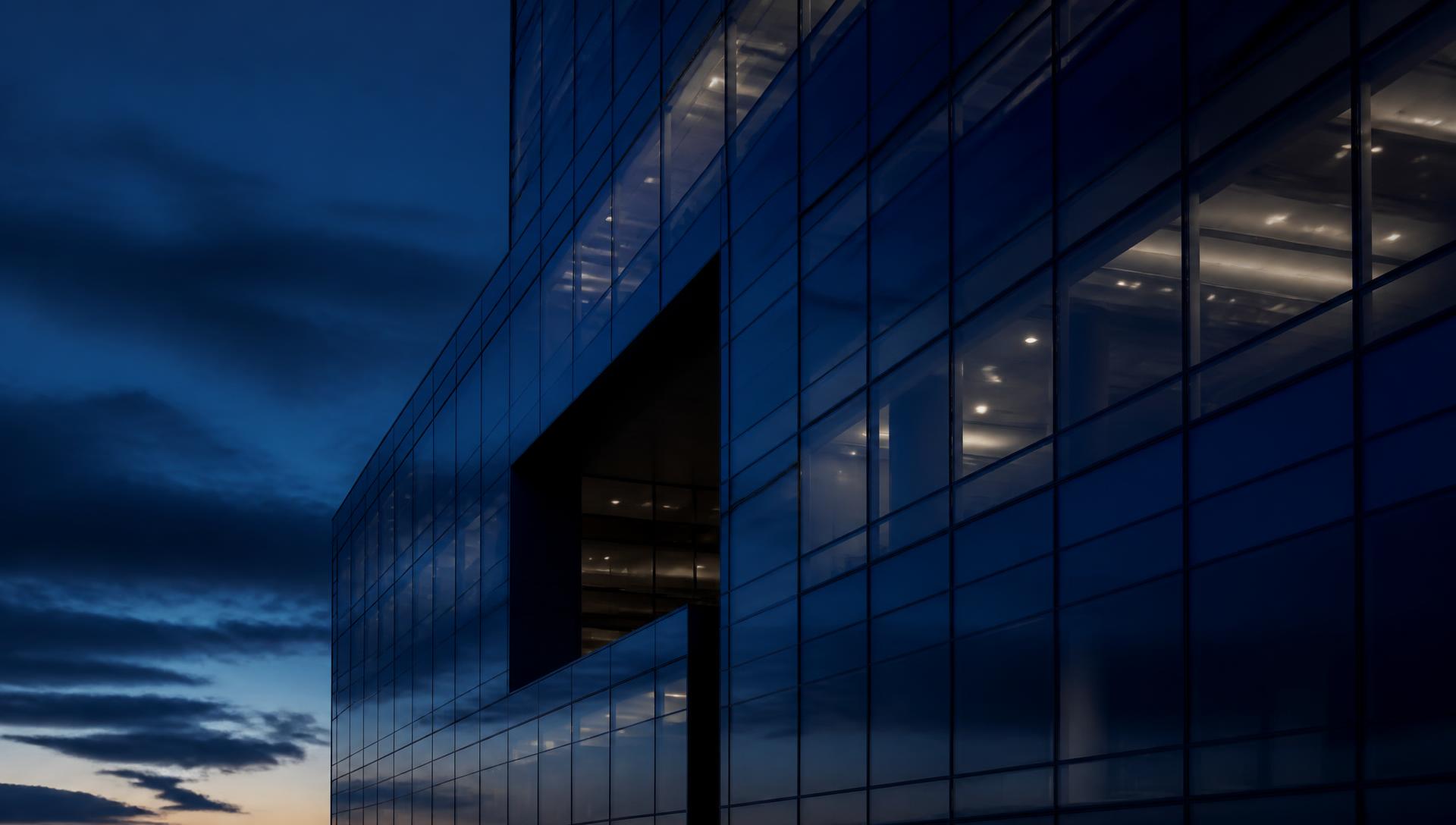 Modern corporate office building at dusk